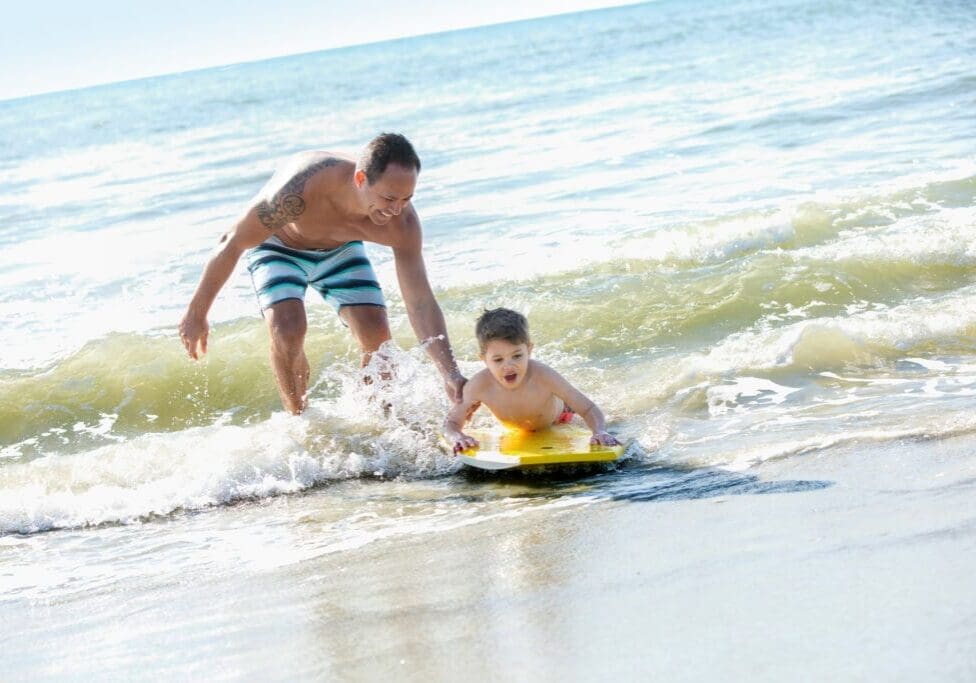 FATHER-SON-ON-BOOGIE-BOARD0210_cc-2100x1400-e5eacfc0-c1b4-42e1-922a-14f9de1b329c